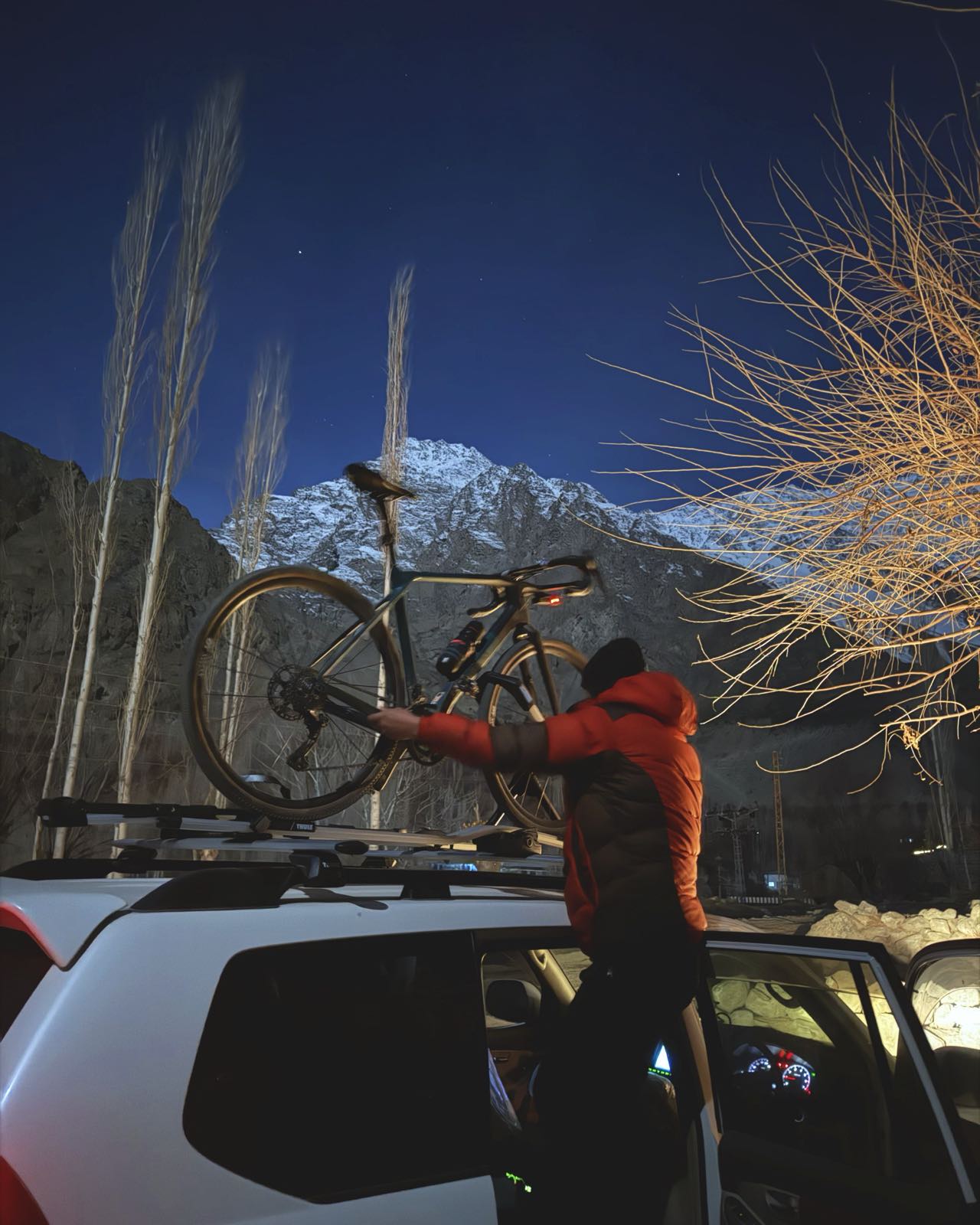 Loading a bicycle by the stairs at Upper Kachura