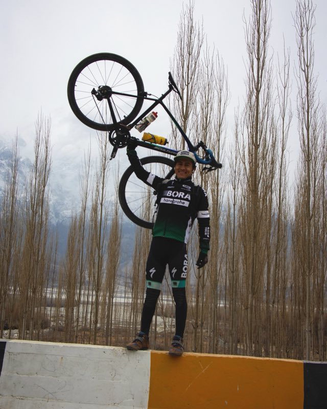 Broko with his bike in the mountains