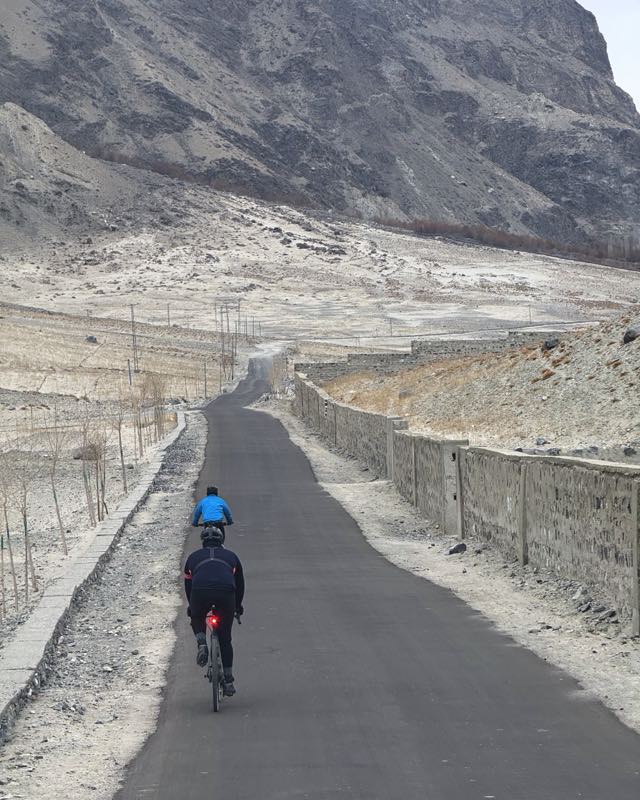 Ejju and Numaan on the long straight road through Shigar