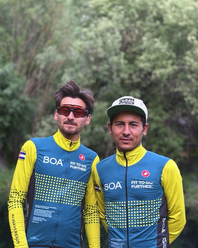 Ejju and Broko posing with their bikes