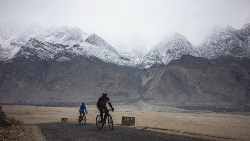 Two riders climbing the road to Shigar