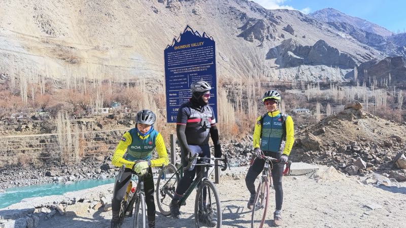 Three riders in the green Ghundus valley
